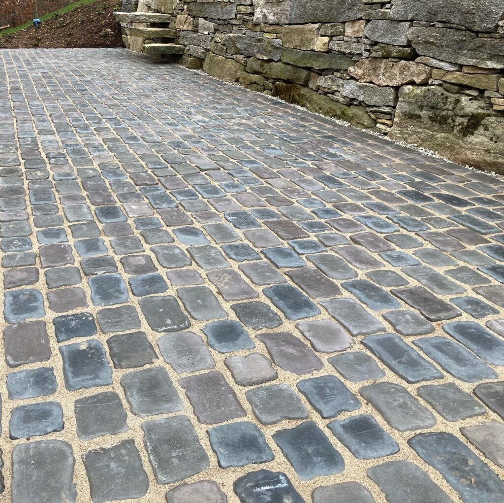 Nice stone paver walkway hardscape with attached retaining wall